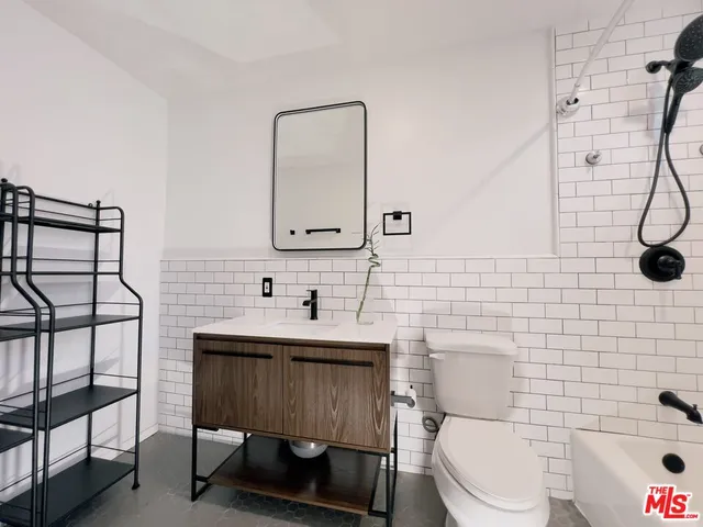 a view of a chairs and table in the backyard