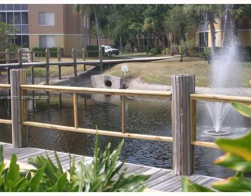 4055 West McNab Road, Unit H303 Pompano Beach, FL 33069 - Photo 12 of 12 a view of outdoor space with garden
