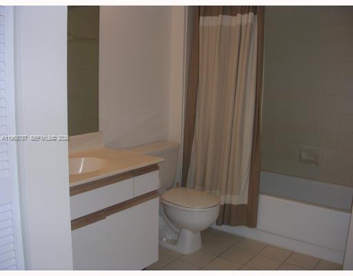 4055 West McNab Road, Unit H303 Pompano Beach, FL 33069 - Photo 6 of 12 a bathroom with a toilet and a shower