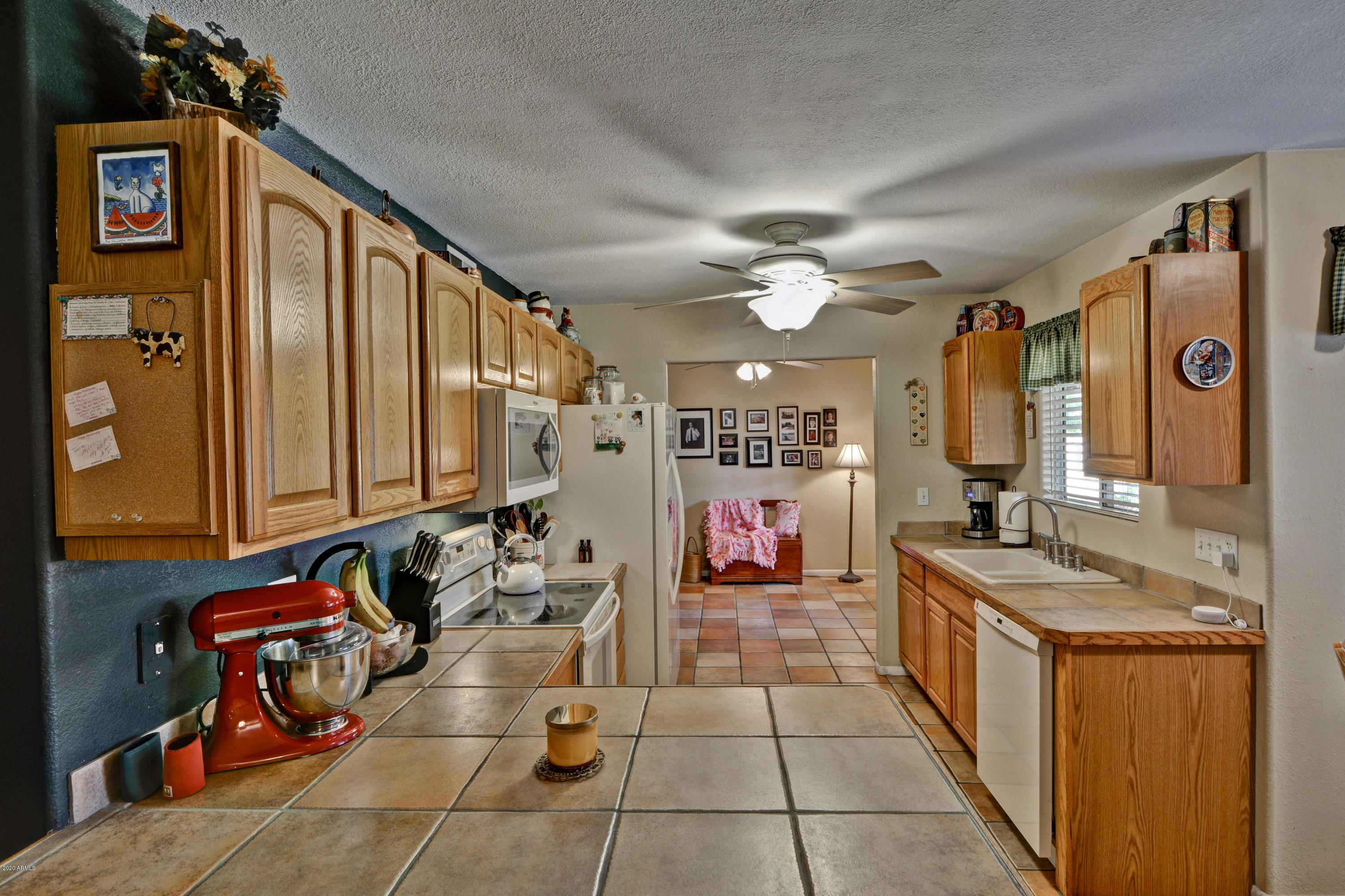 3209 West Cactus Road Phoenix, AZ 85029 - Photo 12 of 35 a bathroom with a granite countertop sink a mirror and shower