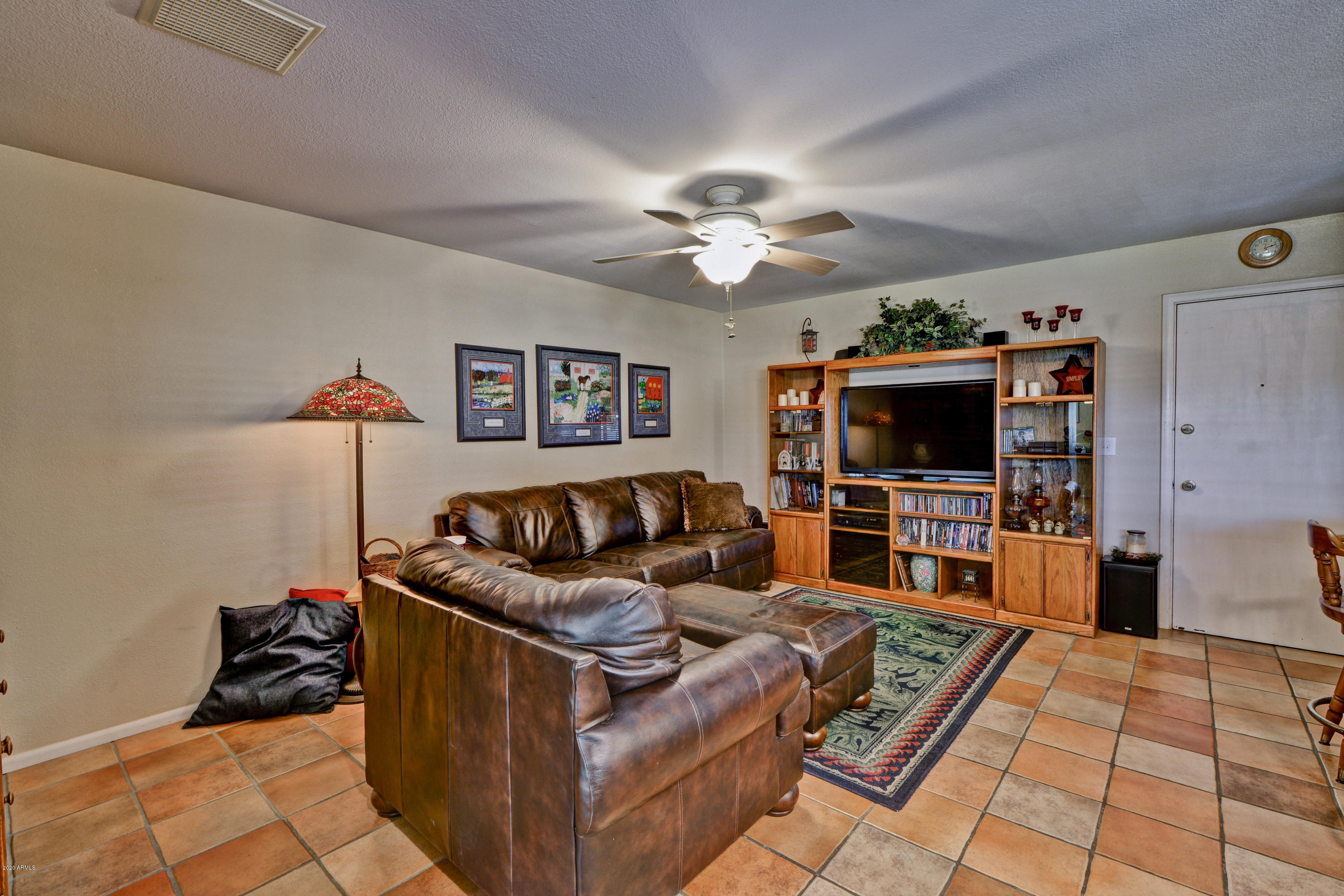 3209 West Cactus Road Phoenix, AZ 85029 - Photo 16 of 35 a living room with furniture and a flat screen tv