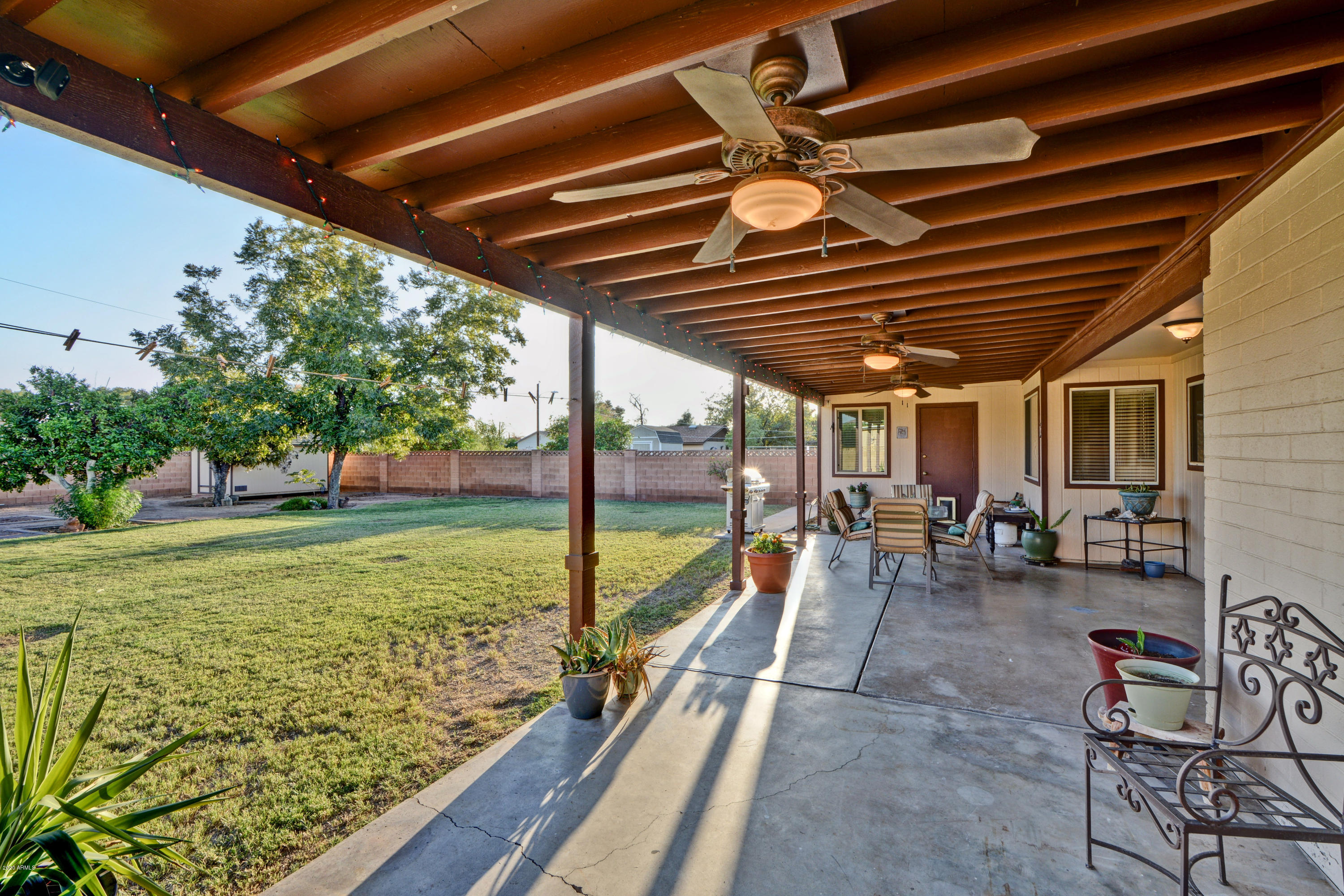 3209 West Cactus Road Phoenix, AZ 85029 - Photo 29 of 35 a view of a porch with furniture and garden