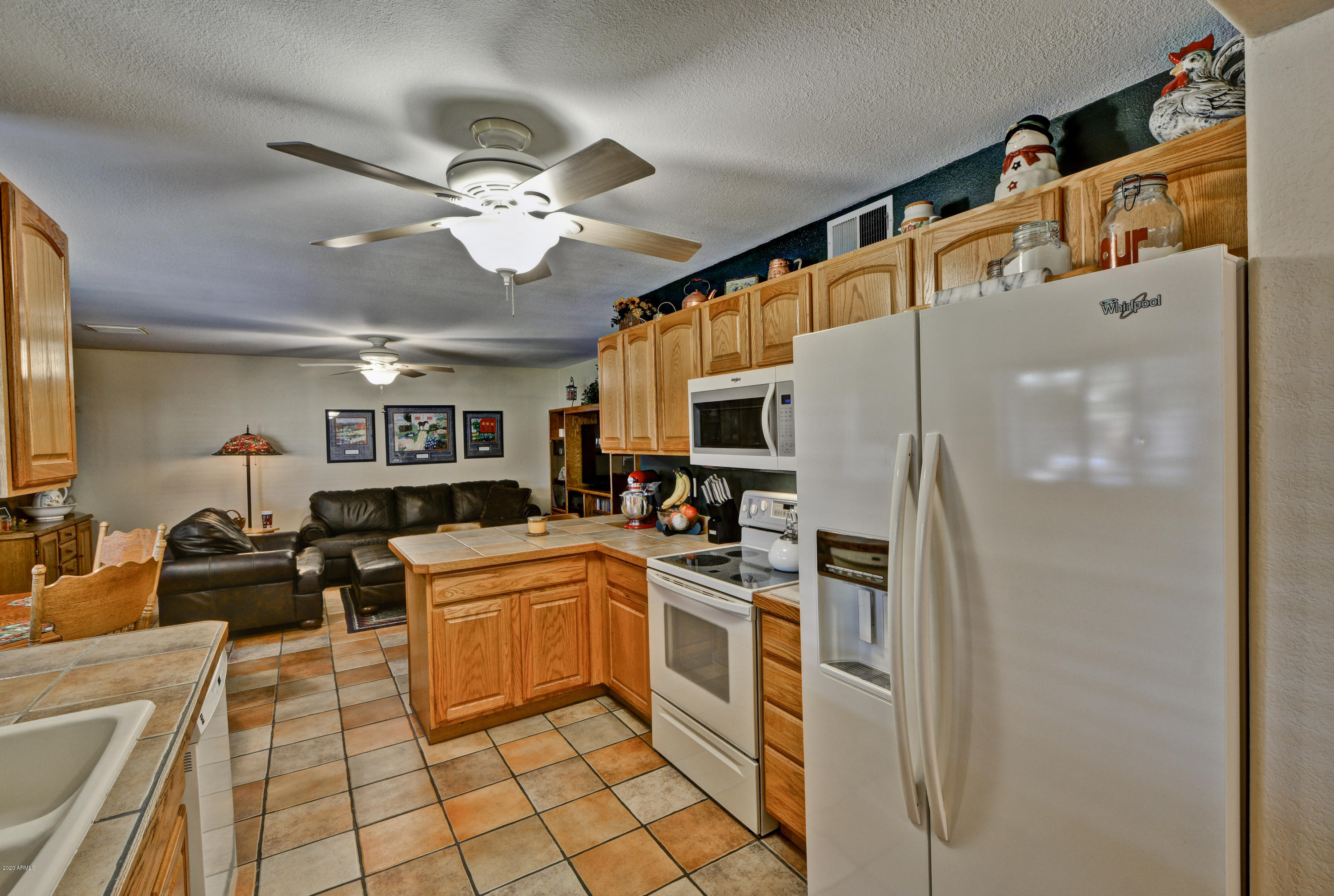 3209 West Cactus Road Phoenix, AZ 85029 - Photo 10 of 35 a kitchen with a sink appliances and cabinets