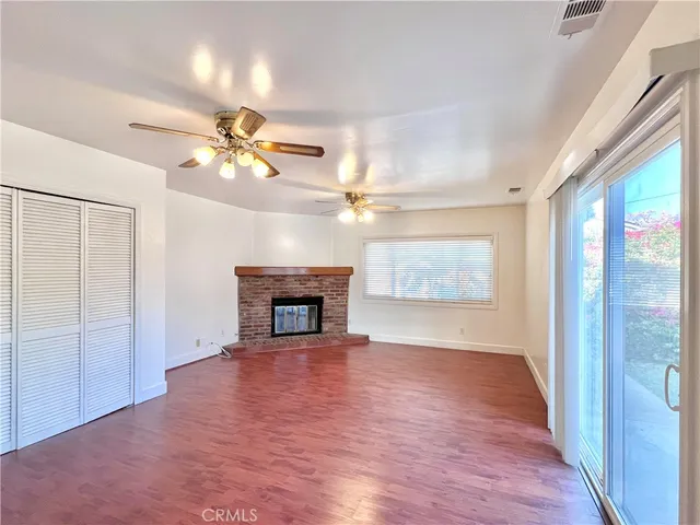 wooden floor with chandelier fan in a room