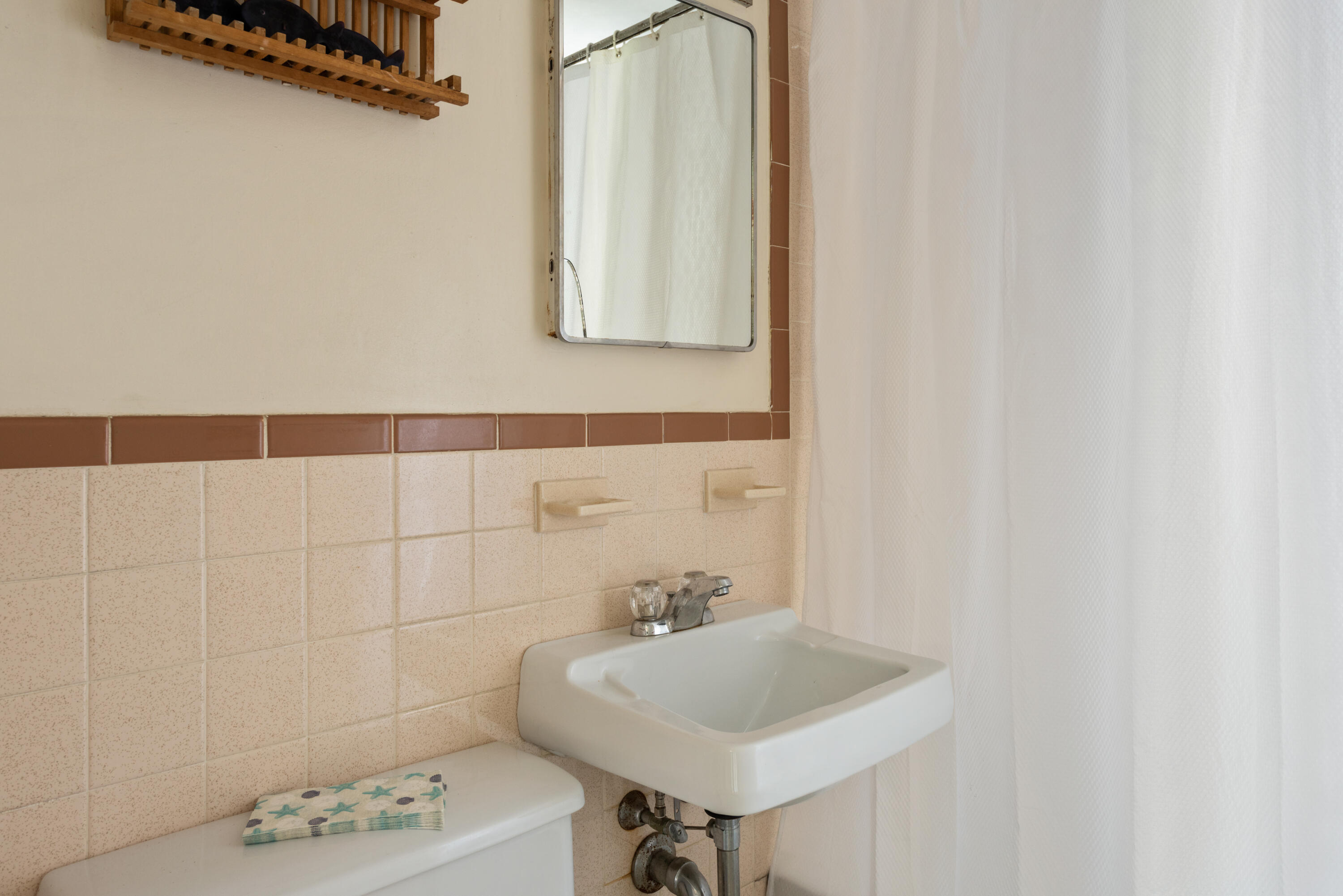 59 Nob Hill Road Chatham, MA 02633 - Photo 12 of 24 a bathroom with a sink a toilet and a mirror