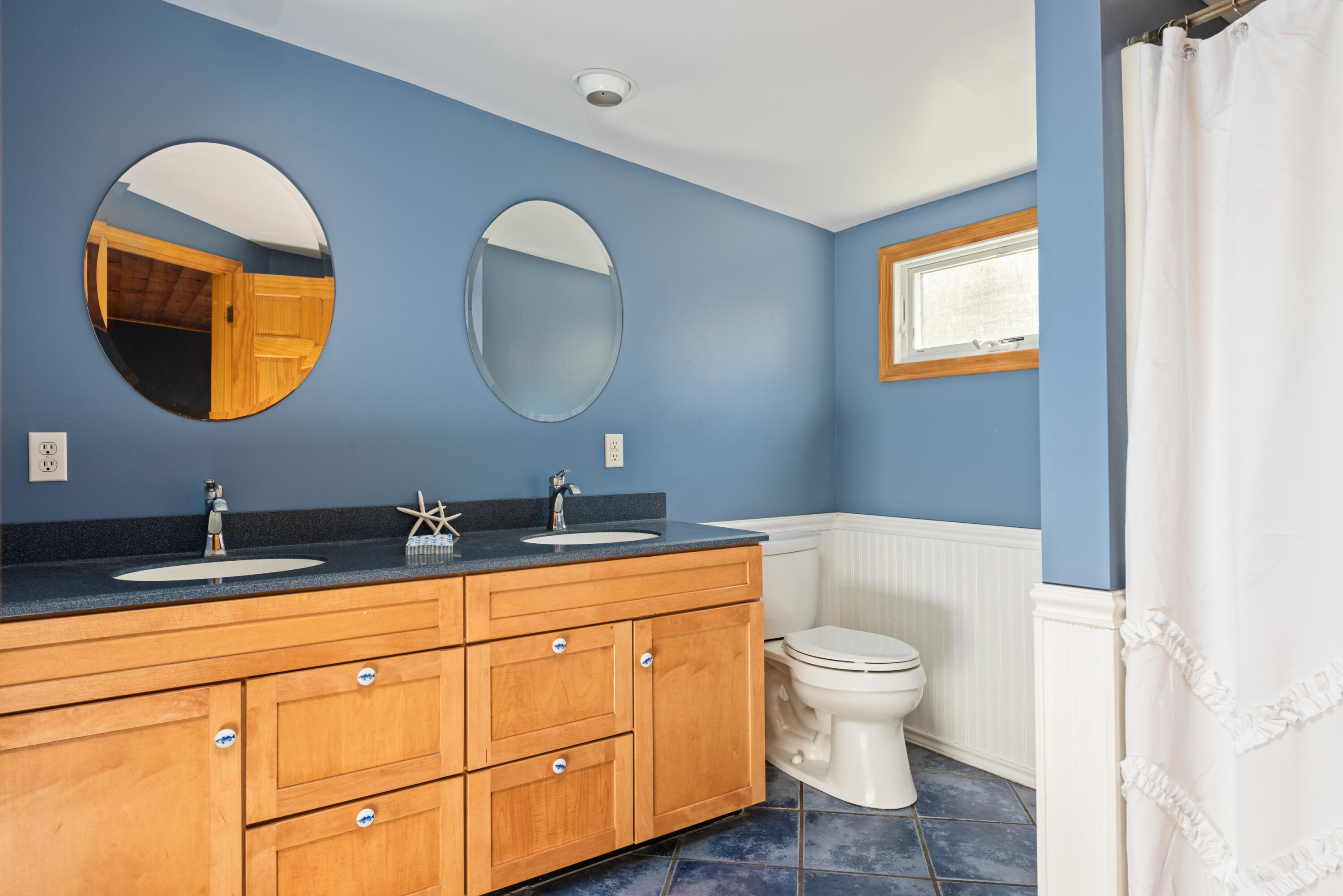 59 Nob Hill Road Chatham, MA 02633 - Photo 15 of 24 a bathroom with a toilet a sink and a mirror