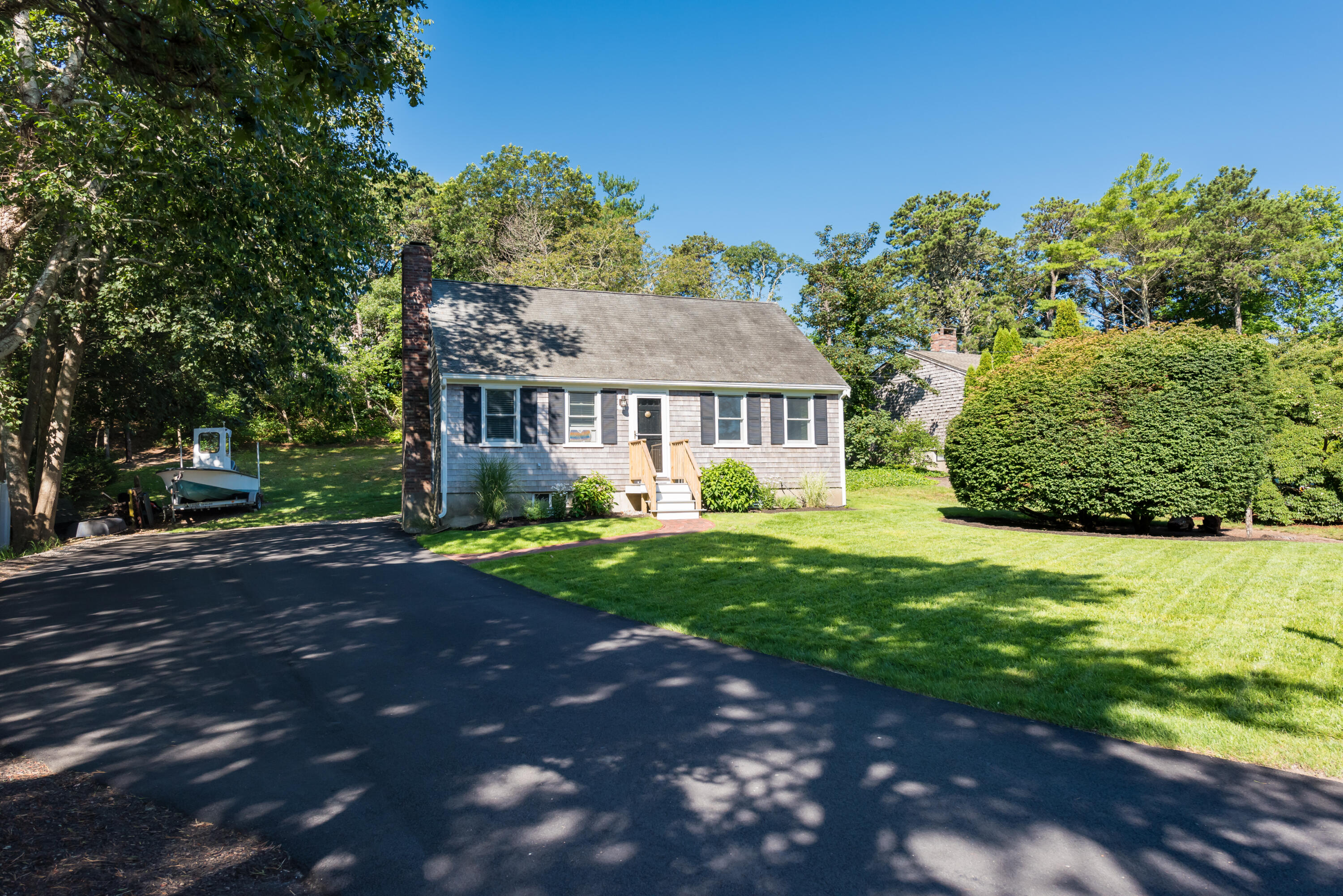 59 Nob Hill Road Chatham, MA 02633 - Photo 16 of 24 a front view of a house with garden