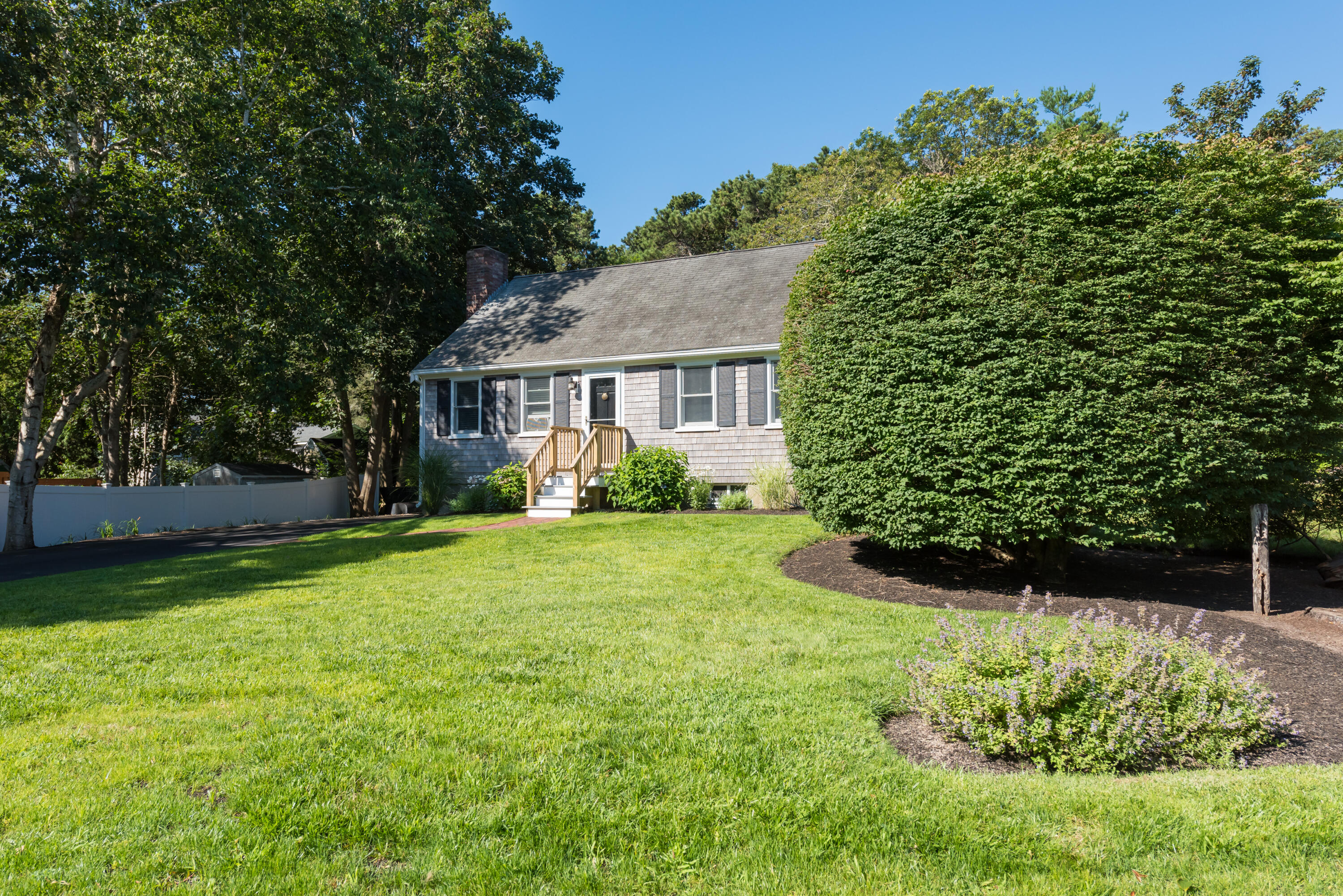 59 Nob Hill Road Chatham, MA 02633 - Photo 17 of 24 a view of a house with a back yard