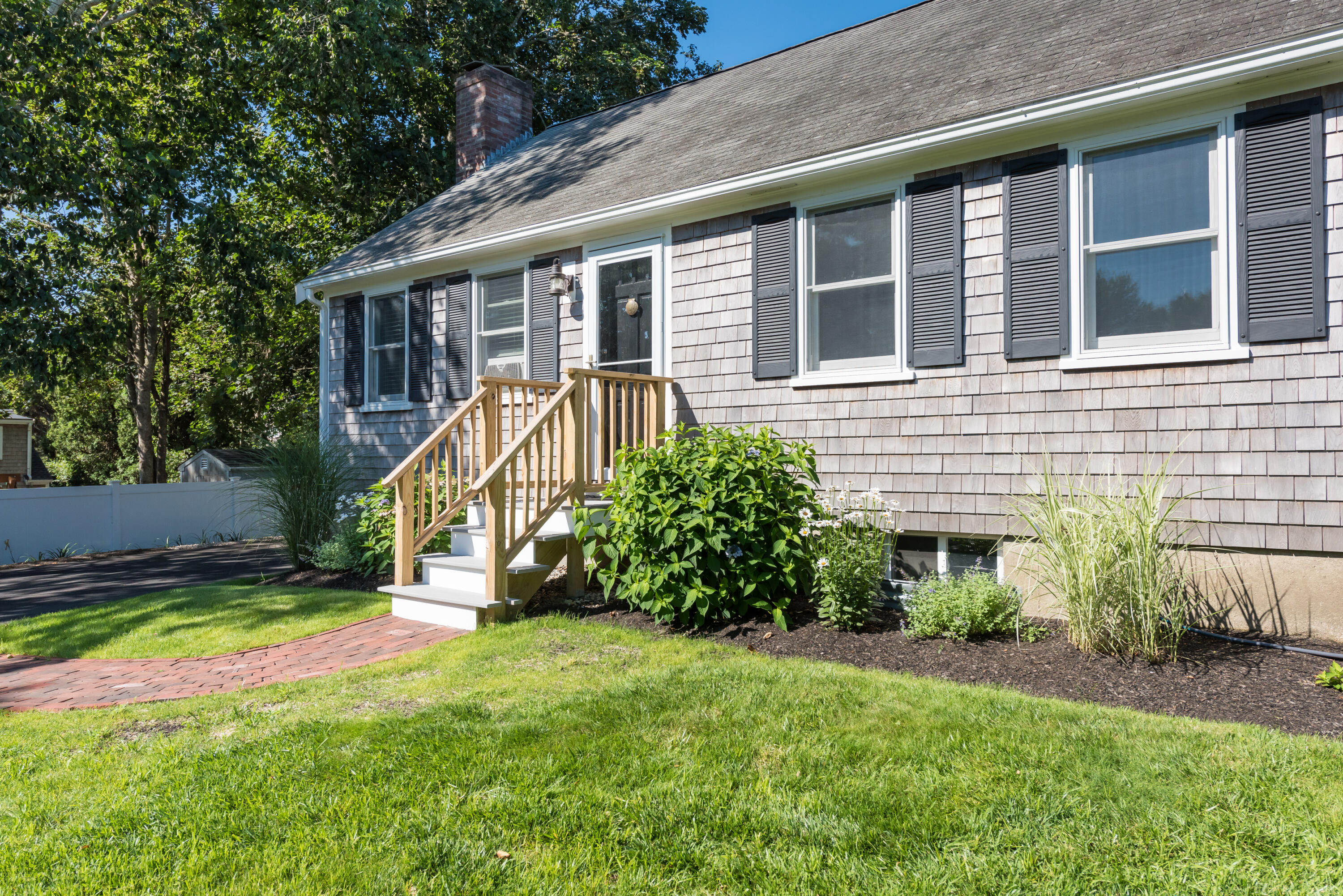 59 Nob Hill Road Chatham, MA 02633 - Photo 18 of 24 a view of a house with a yard and a large tree