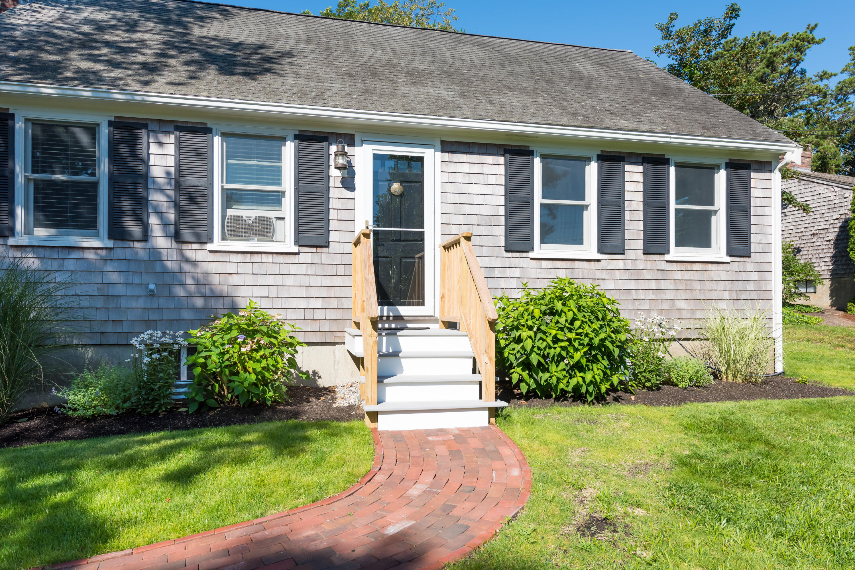 59 Nob Hill Road Chatham, MA 02633 - Photo 2 of 24 a front view of a house with garden