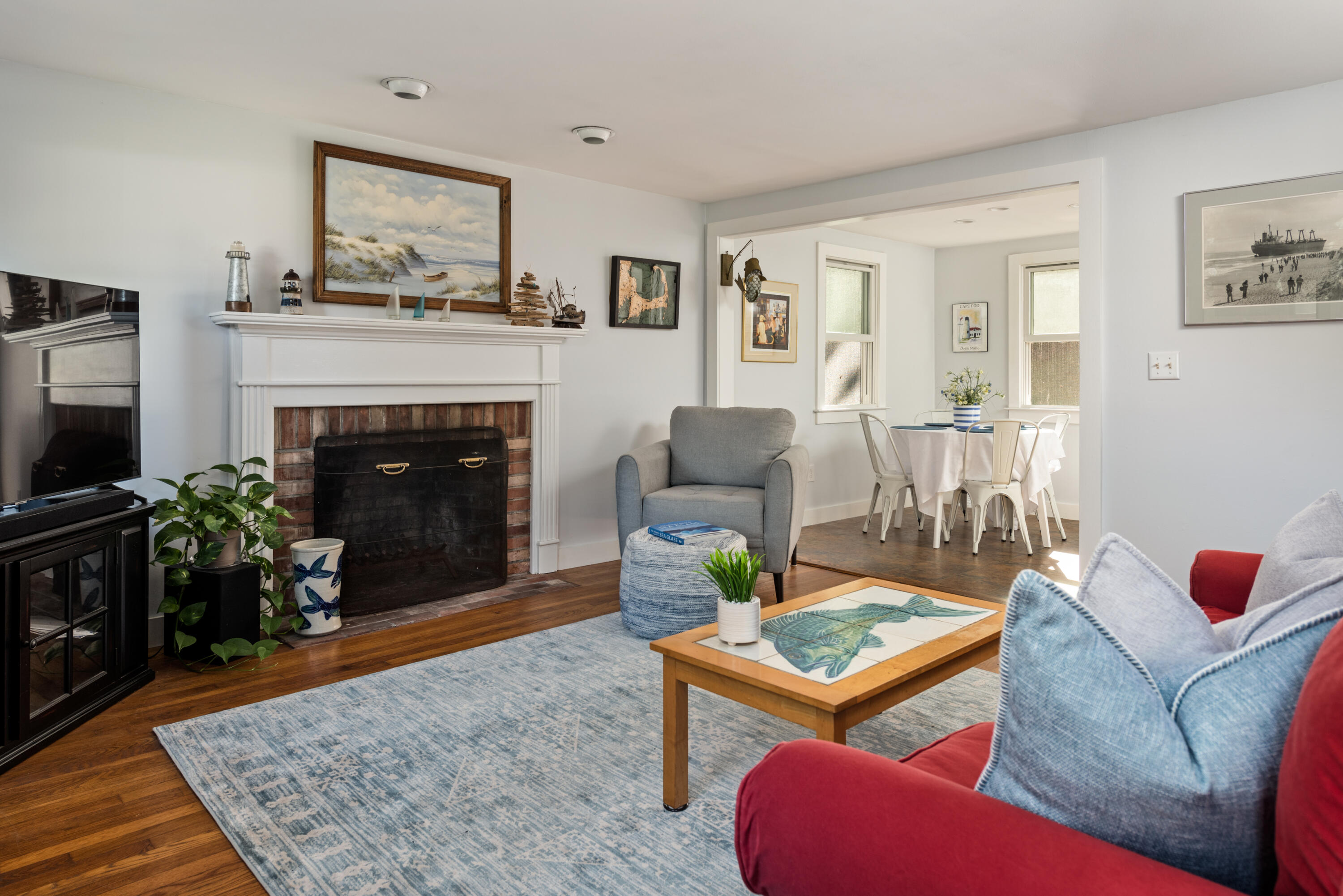 59 Nob Hill Road Chatham, MA 02633 - Photo 4 of 24 a living room with furniture and a fireplace