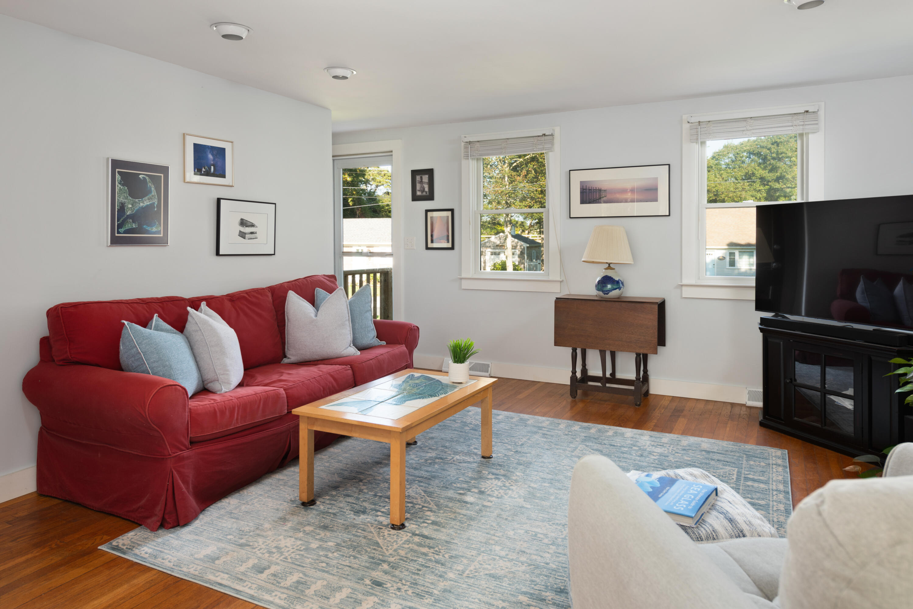 59 Nob Hill Road Chatham, MA 02633 - Photo 5 of 24 a living room with furniture a window and a flat screen tv