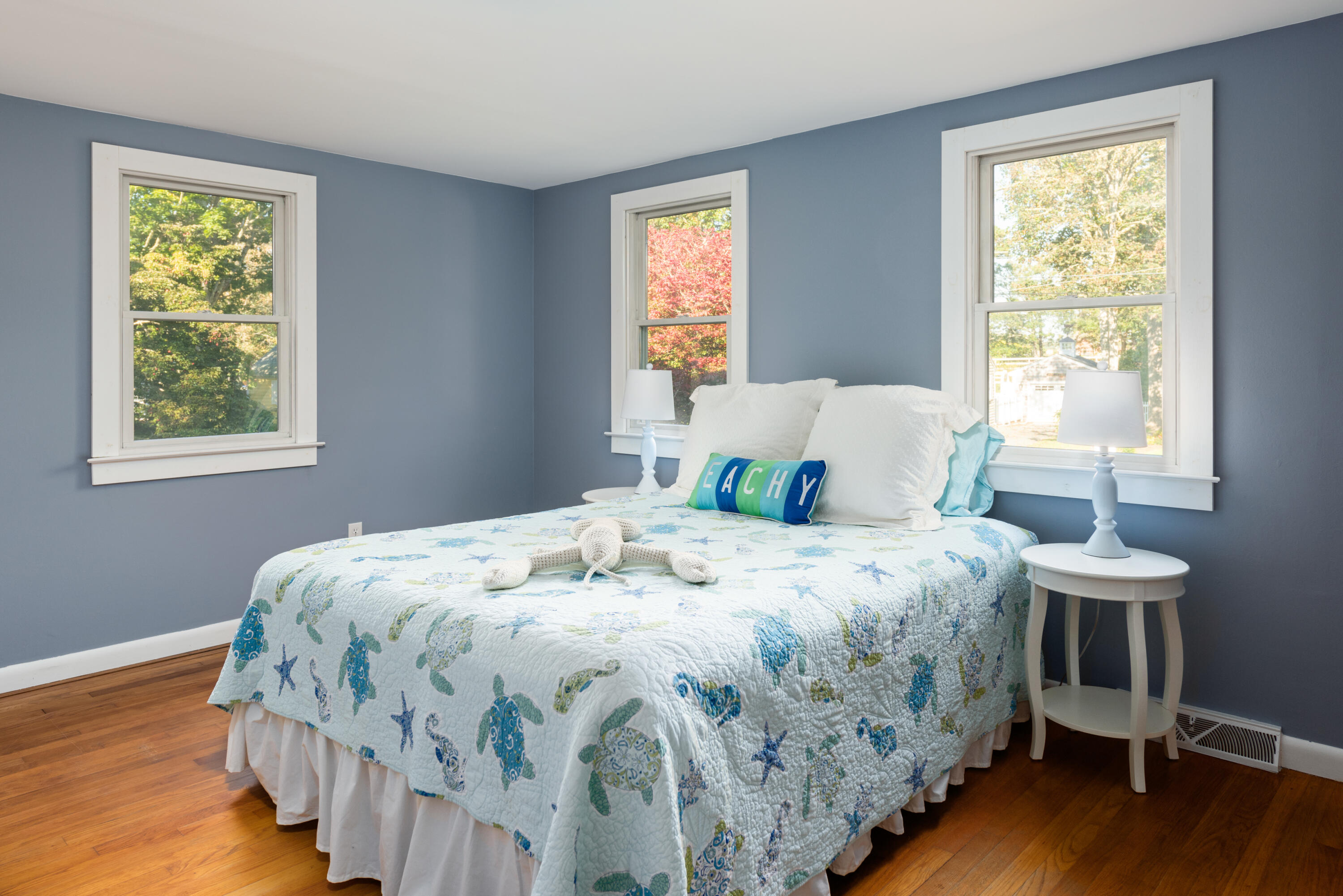 59 Nob Hill Road Chatham, MA 02633 - Photo 10 of 24 a bedroom with a bed and a table lamp