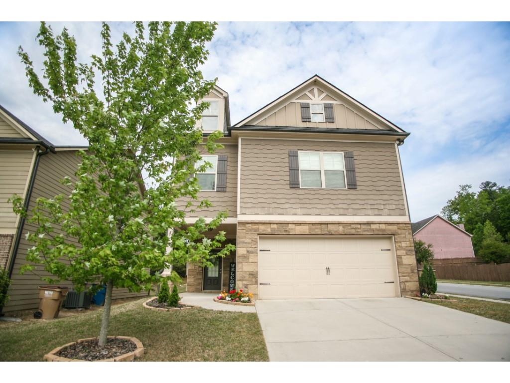 7421 Silk Tree Pointe Braselton, GA 30517 - Photo 1 of 1 a front view of a house with a yard