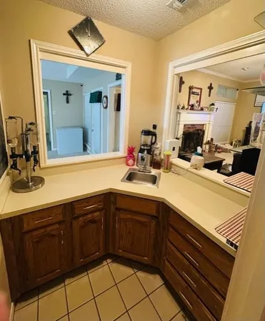 a spacious bathroom with a double vanity sink a large mirror a shower and vanity