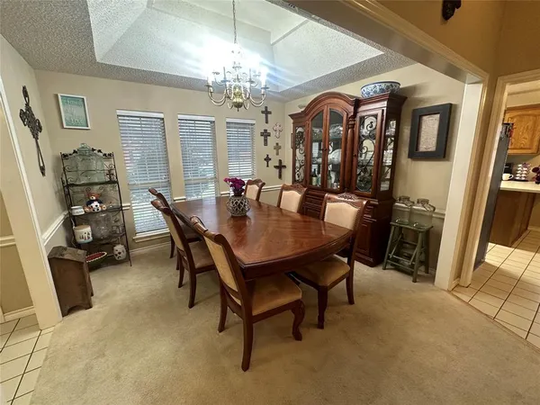 a view of a big room with furniture and a window