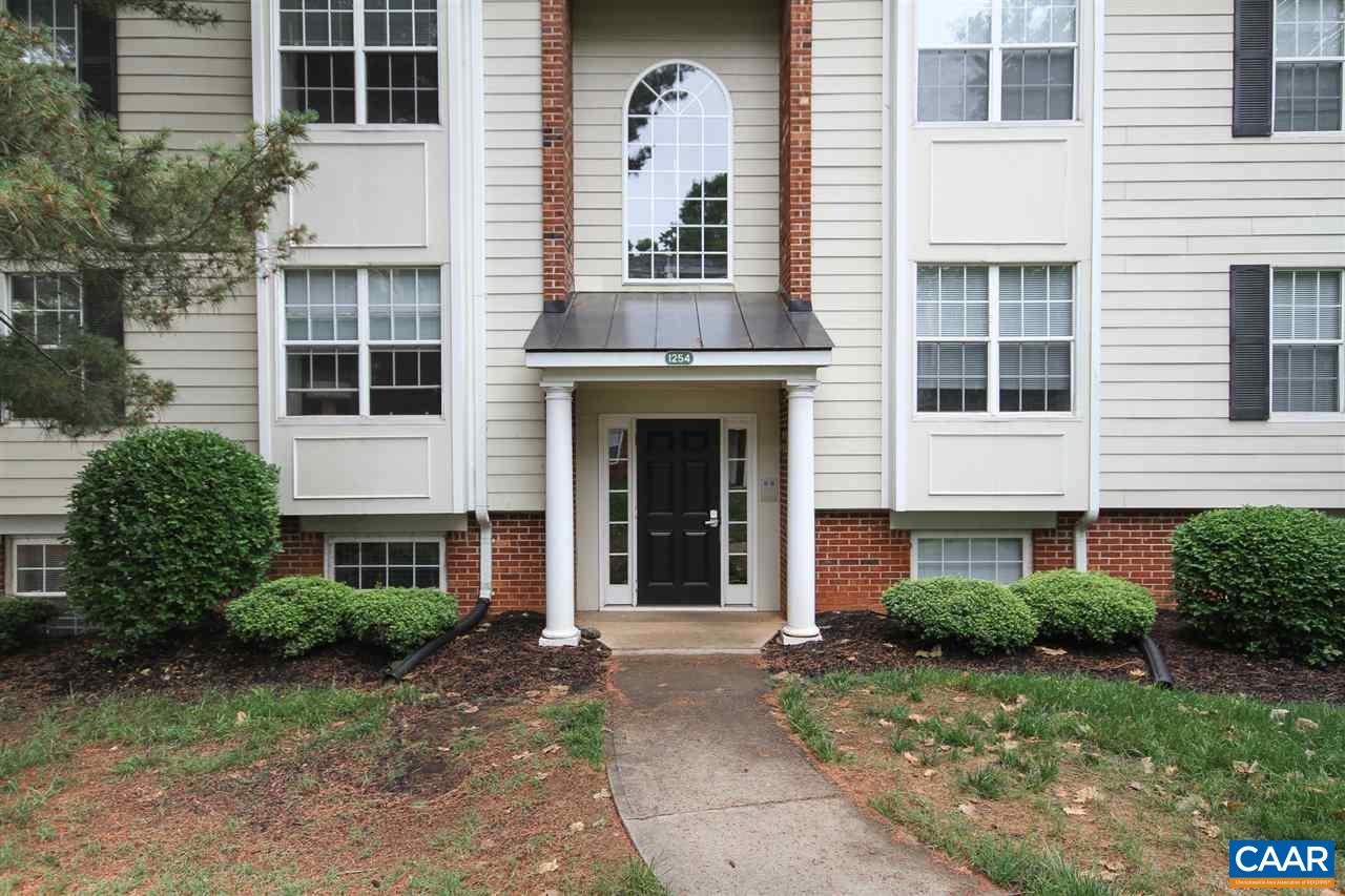 a view of a building with a yard