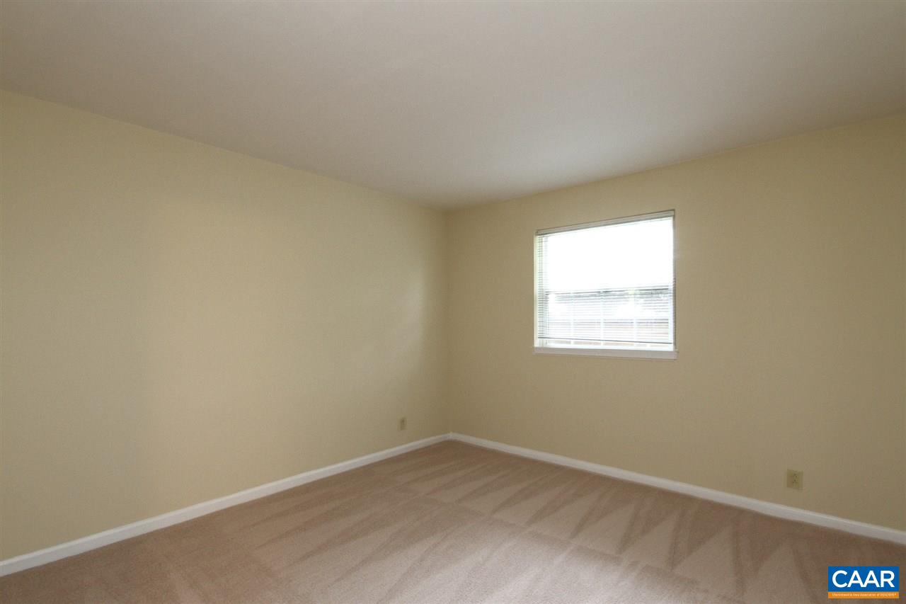 1254 Villa Lane, Unit A Charlottesville, VA 22903 - Photo 8 of 10 an empty room with a window