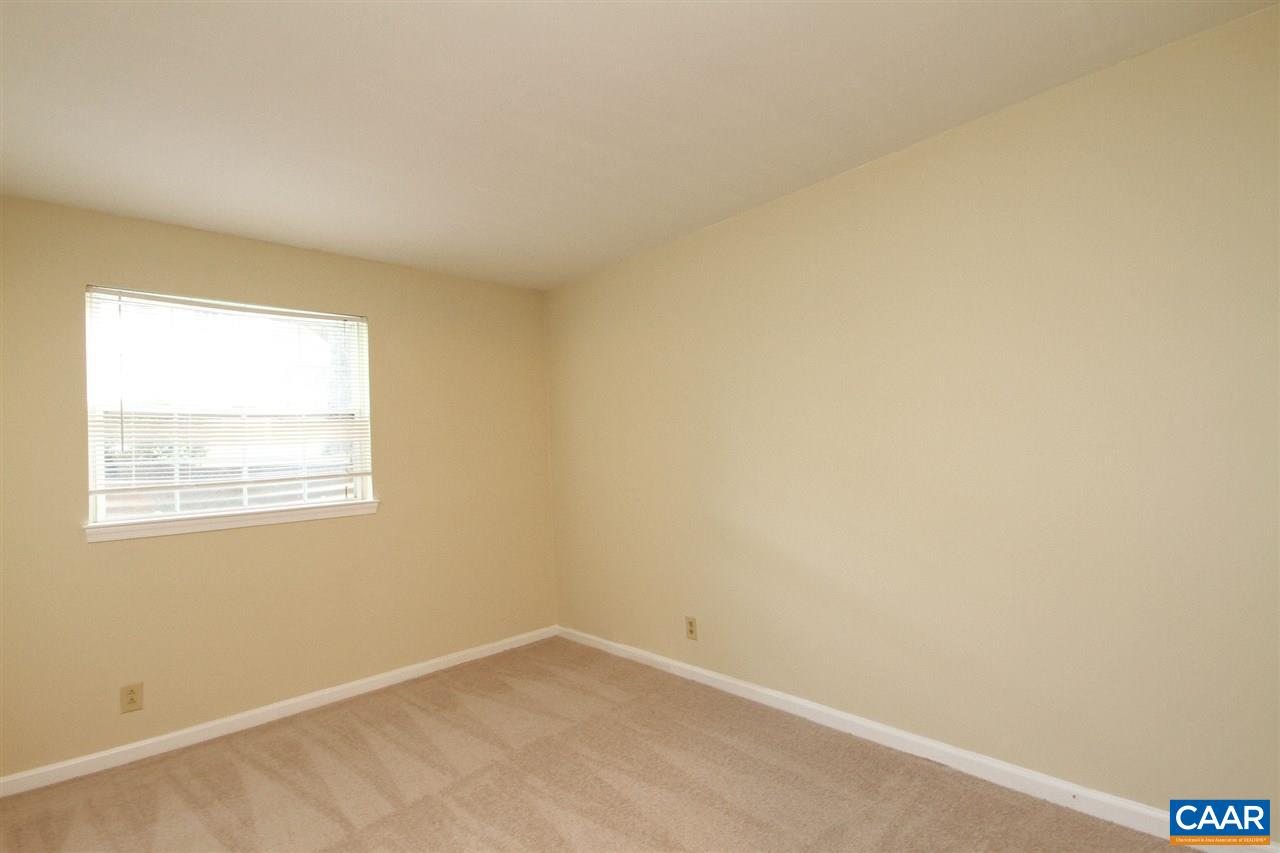 1254 Villa Lane, Unit A Charlottesville, VA 22903 - Photo 9 of 10 an empty room with a window