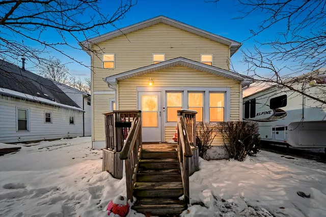 a view of a house with wooden walls