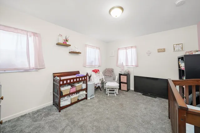 a bathroom with a toilet a sink and a shower