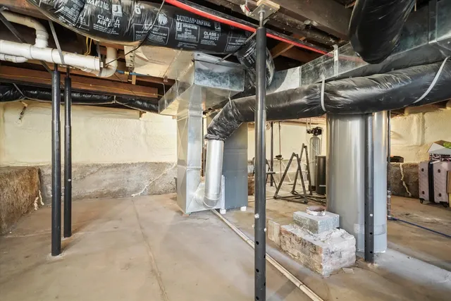 a white house that has a tree in front of it