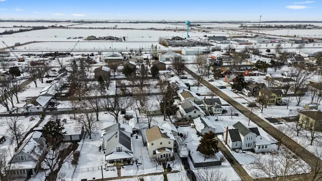 a picture of a bench in front of a wall