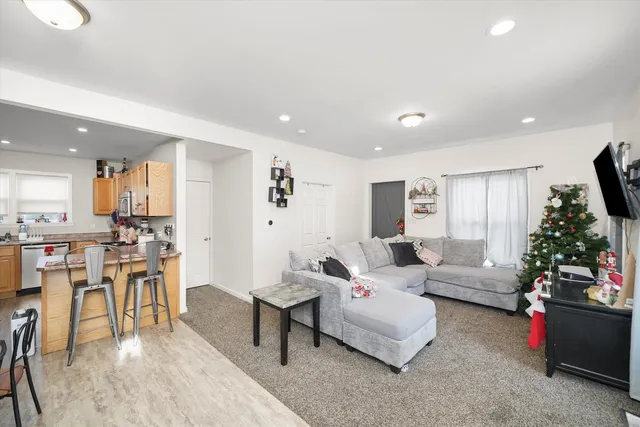 a kitchen with stainless steel appliances granite countertop a refrigerator oven a stove top oven a sink and dishwasher