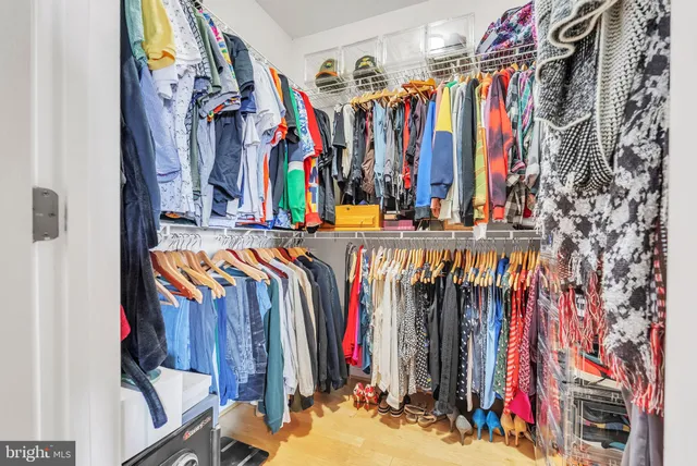 a kitchen with stainless steel appliances kitchen island granite countertop a table and chairs in it