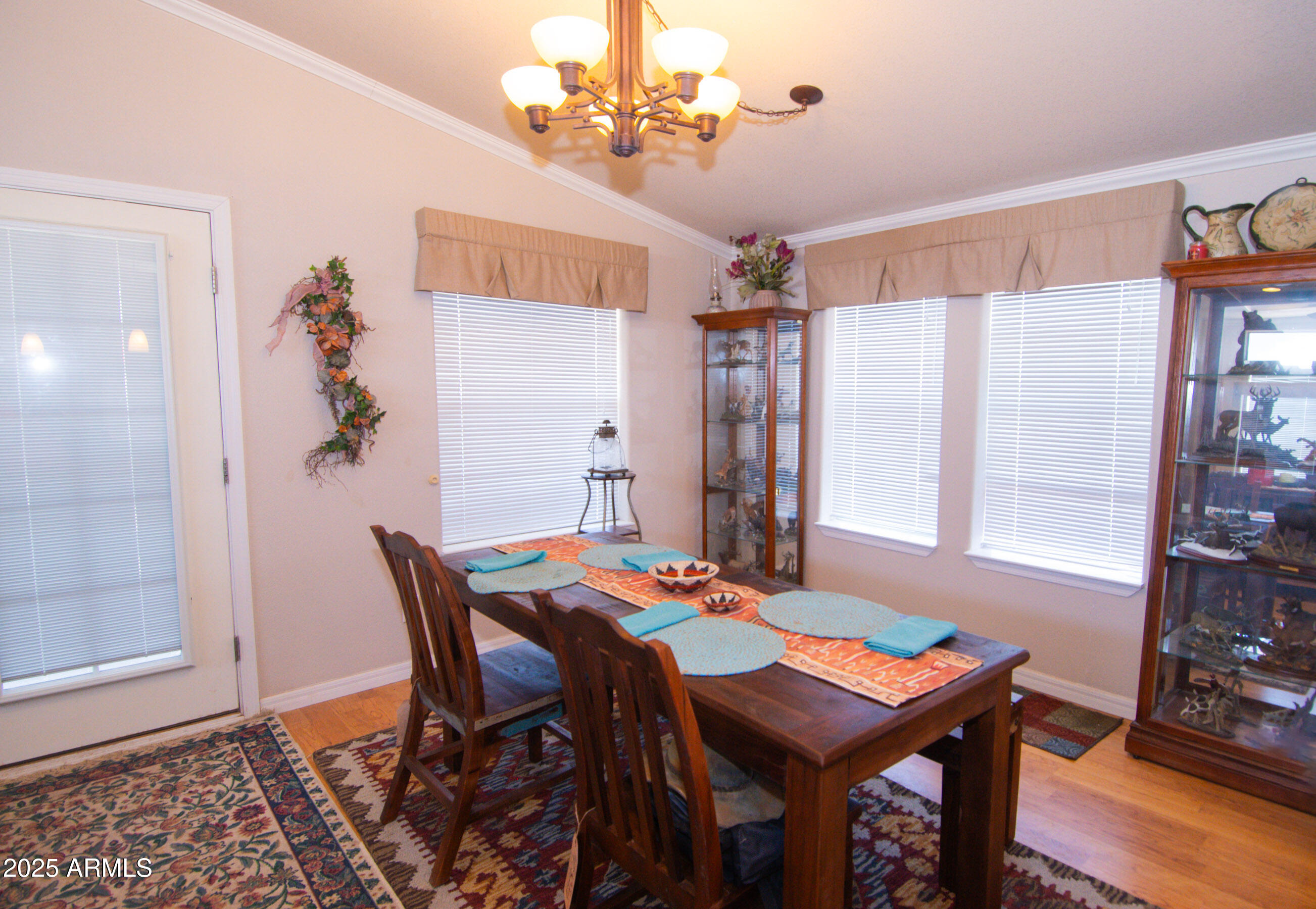 61 County Rd N6379 St. Johns, AZ 85936 - Photo 13 of 33 a view of a dining room with furniture and wooden floor