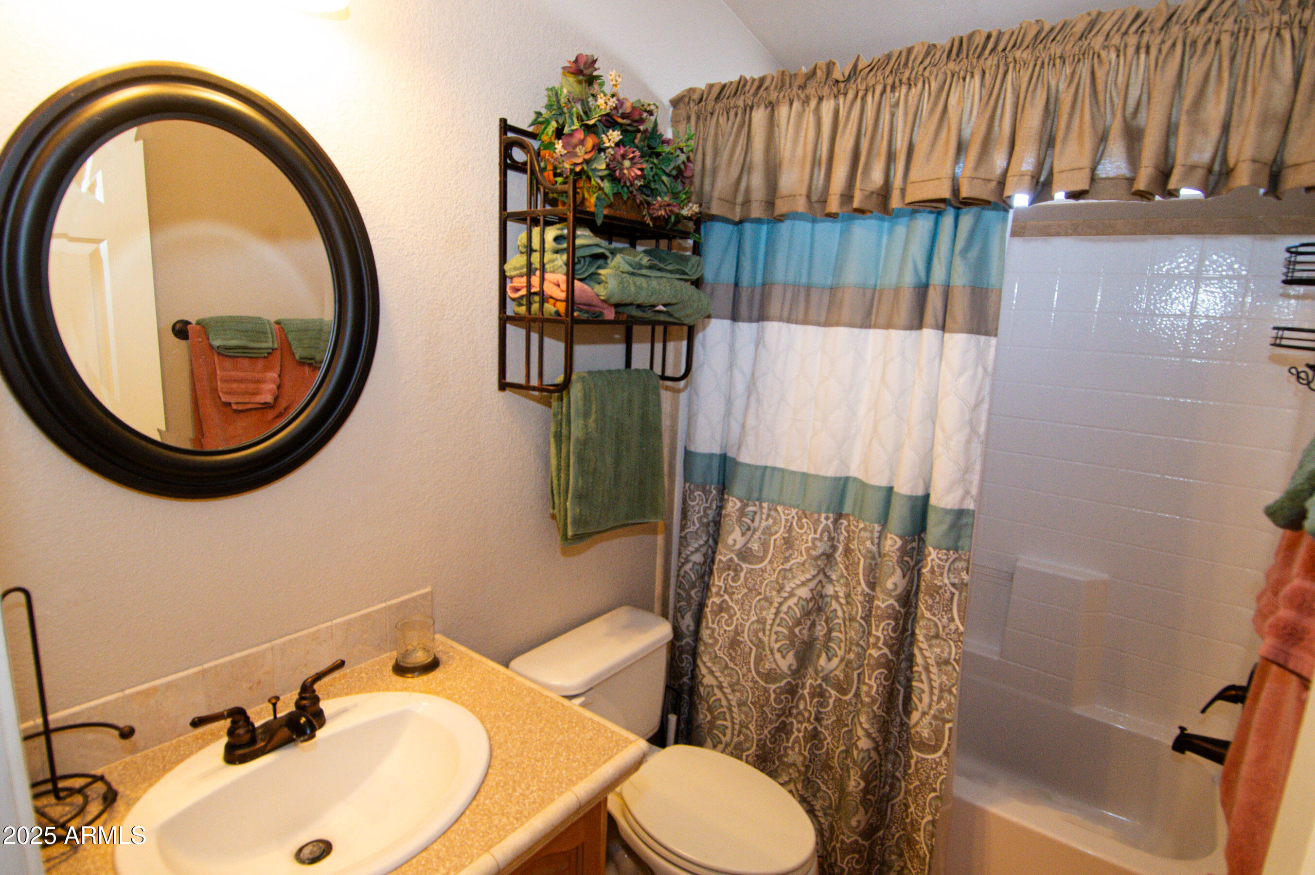 61 County Rd N6379 St. Johns, AZ 85936 - Photo 16 of 33 a bathroom with a sink toilet and a mirror