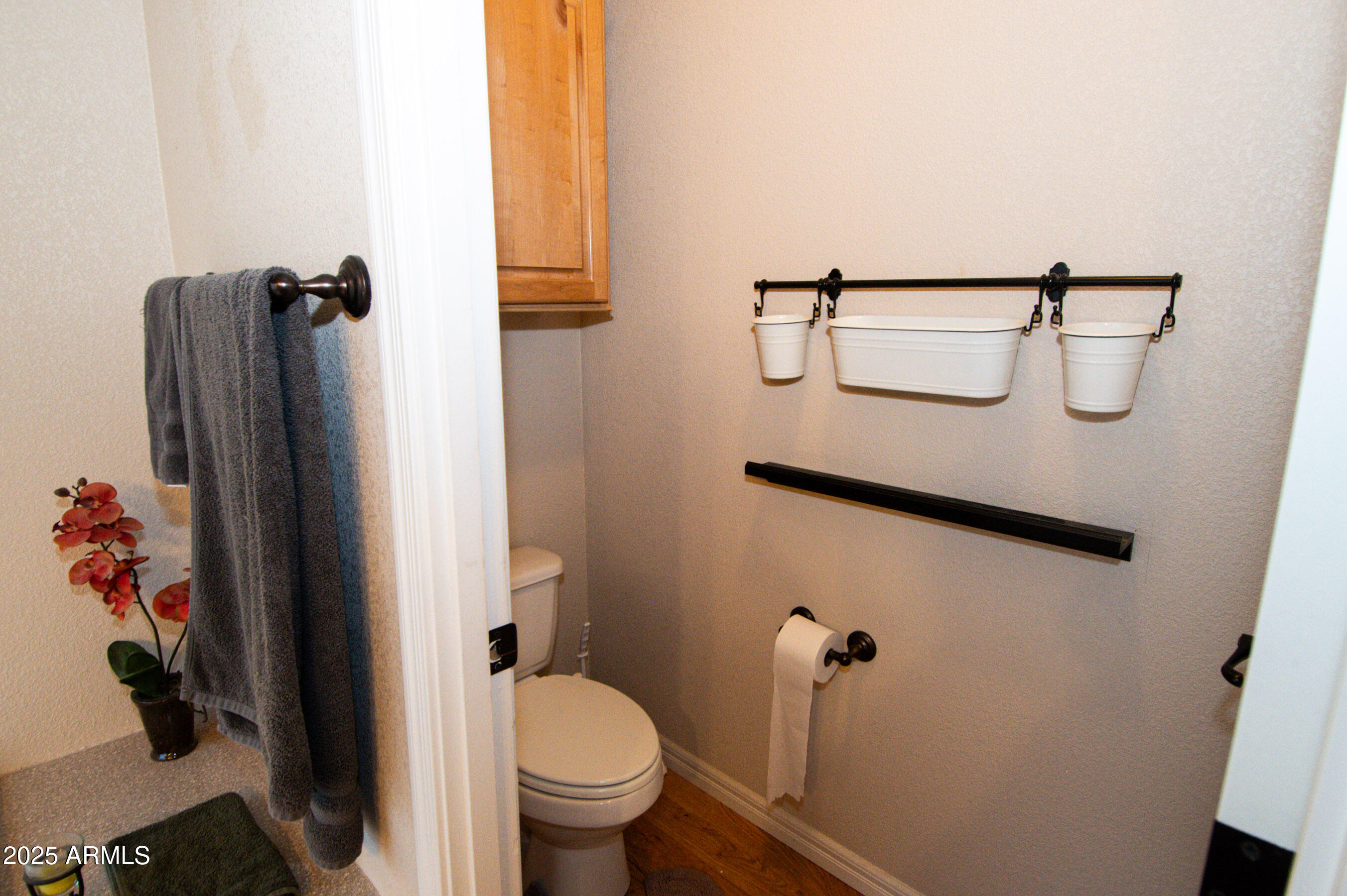 61 County Rd N6379 St. Johns, AZ 85936 - Photo 23 of 33 a bathroom with a toilet and a shower curtain