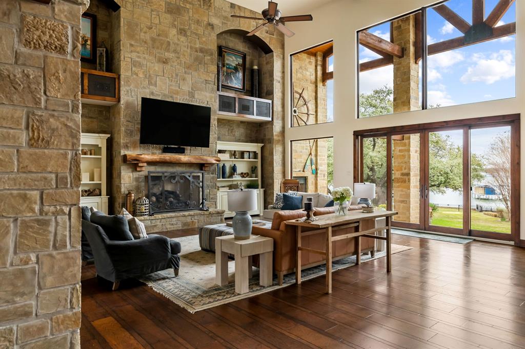 9930 Boat Club Road Fort Worth, TX 76179 - Photo 9 of 40 Main residence great room features beamed sky-high ceilings and floor to ceiling windows providing stunning views of the water.