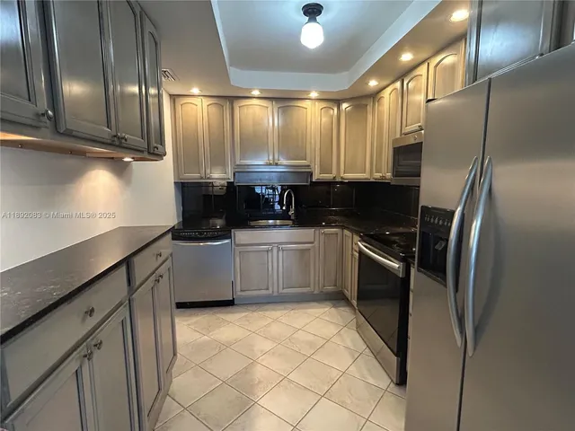 a view of a kitchen with wooden floor