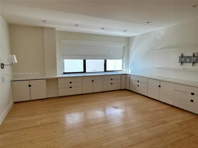 a view of room with wooden floor and window