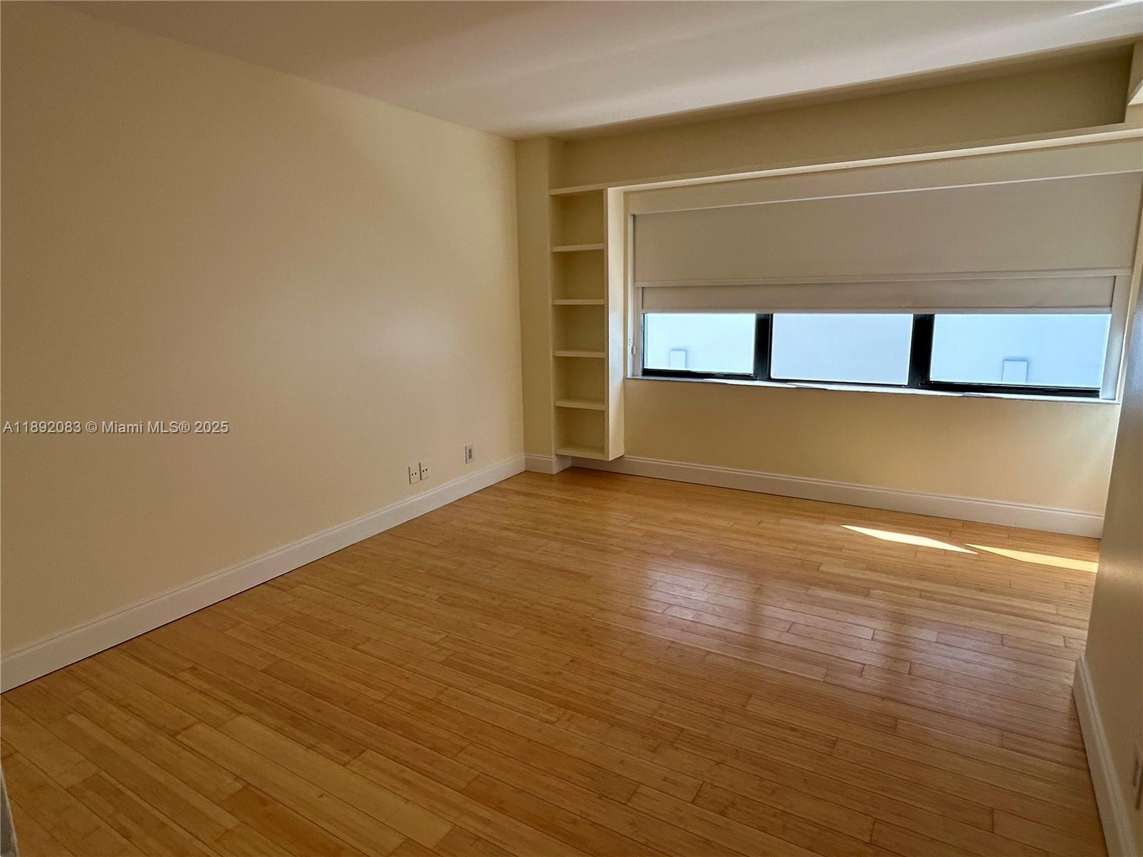 5415 Collins Avenue, Unit 302 Miami Beach, FL 33140 - Photo 16 of 33 a view of room with wooden floor and window