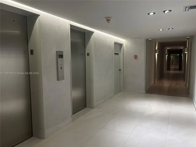 an empty room with wooden floor