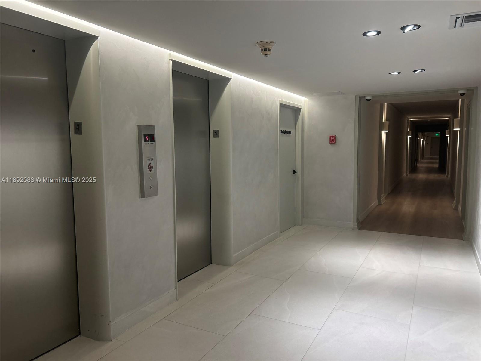 5415 Collins Avenue, Unit 302 Miami Beach, FL 33140 - Photo 9 of 33 an empty room with wooden floor