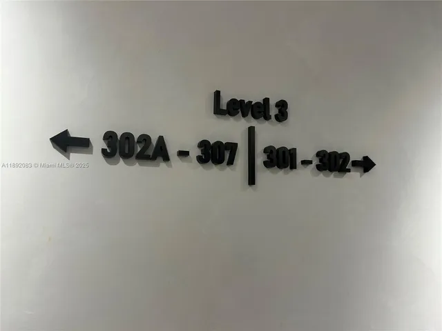 a kitchen with a sink cabinets and stainless steel appliances