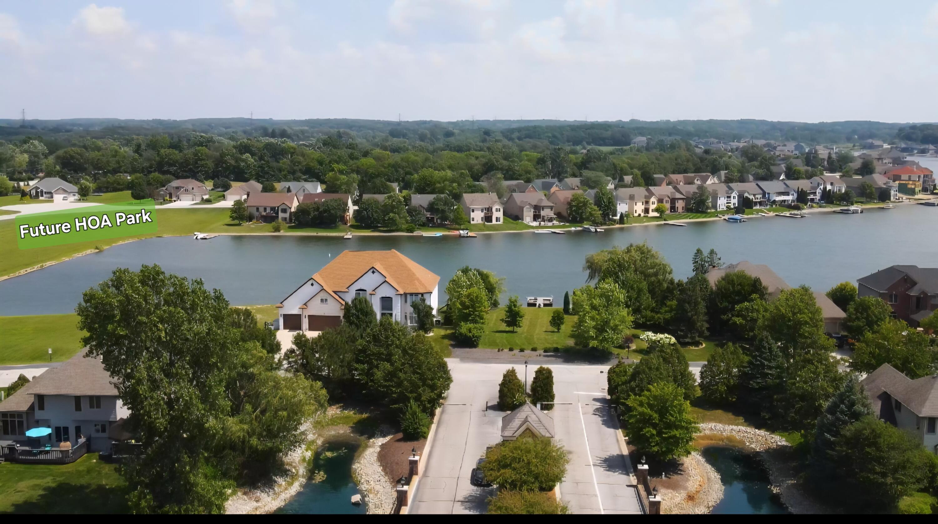 8130 Lakeview Court Winfield, IN 46307 - Photo 7 of 27 an aerial view of residential houses with outdoor space and lake view