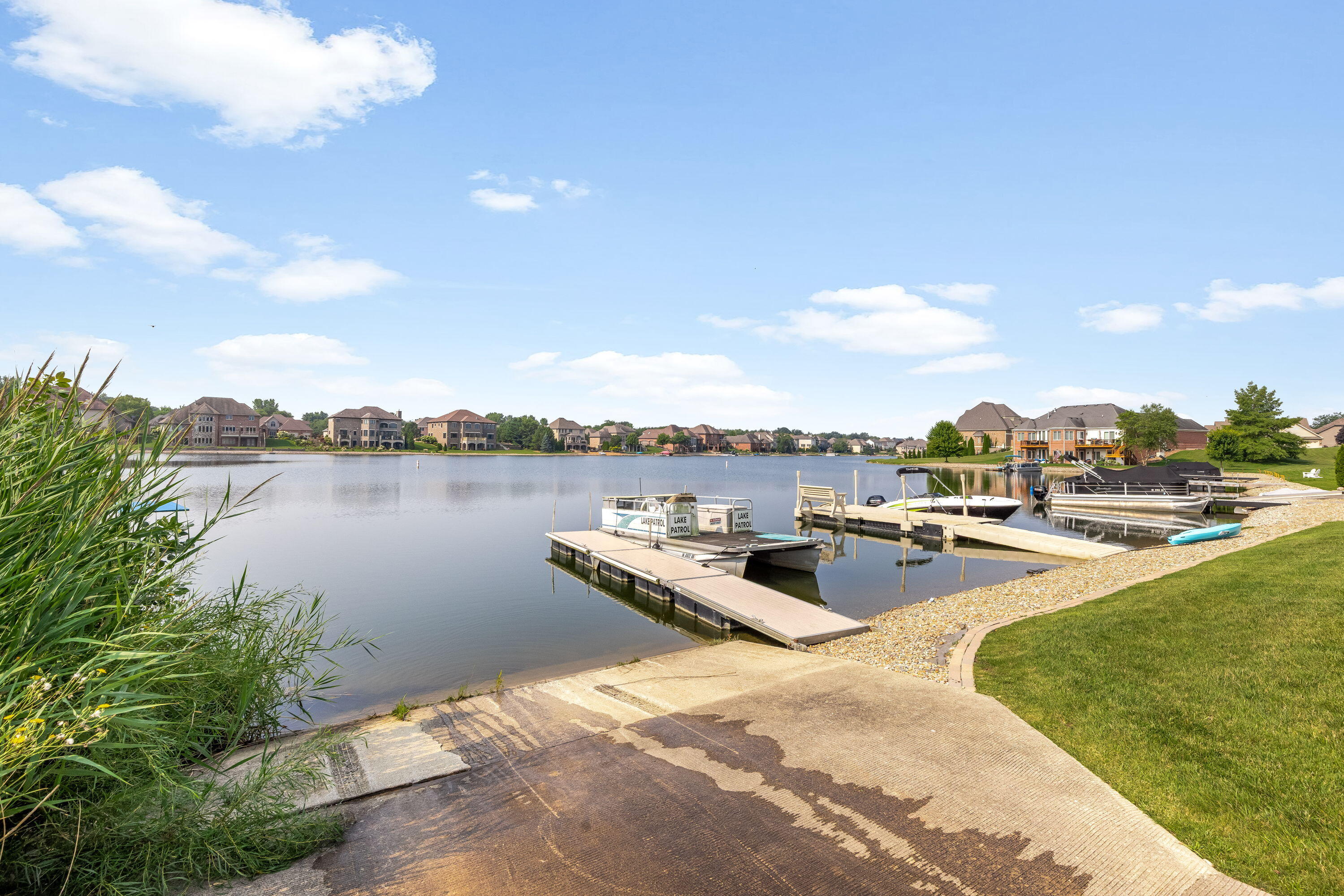 8130 Lakeview Court Winfield, IN 46307 - Photo 8 of 27 a view of a lake with couches and city view
