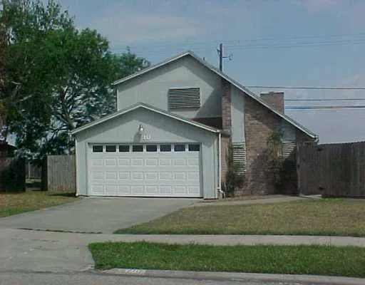 a front view of a house with a garage