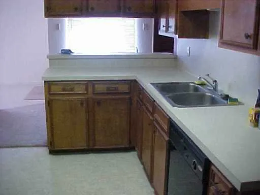 a kitchen with a sink and a stove