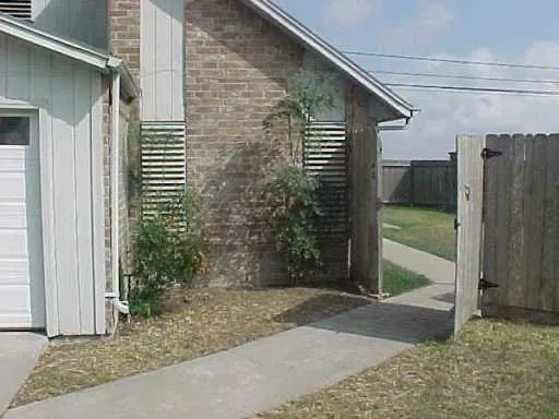 a view of a back yard of the house