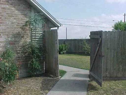 a view of a backyard with pathway