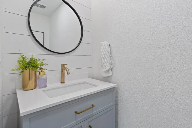 a kitchen with a stove and a refrigerator