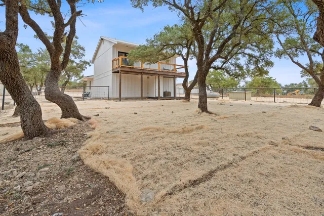 a view of a balcony with wooden floor
