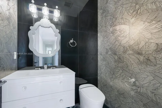 an aerial view of a house with a lake view