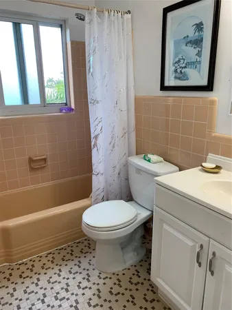 a bathroom with a toilet a sink and a bathtub