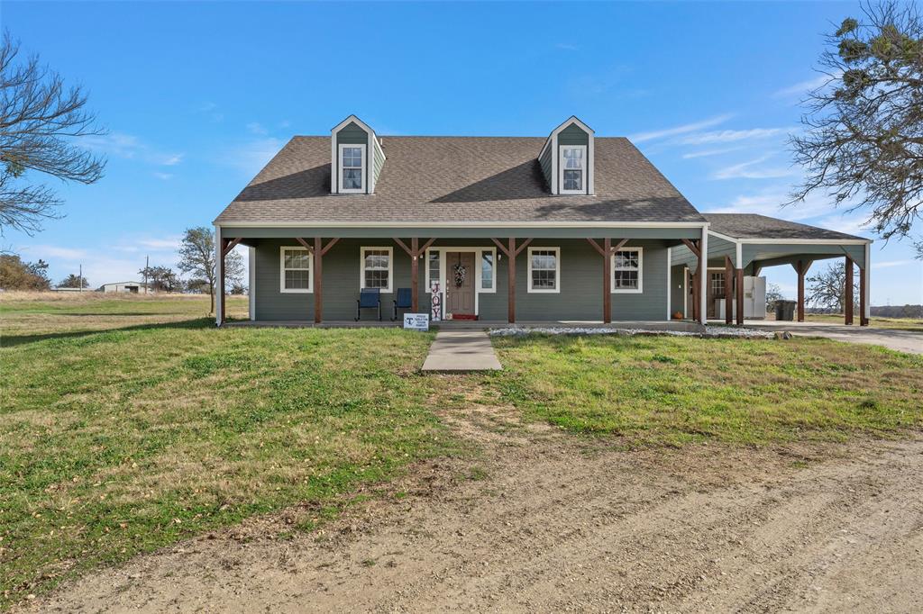 1170 Lumkins Road Forreston, TX 76041 - Photo 17 of 40 a front view of a house with garden